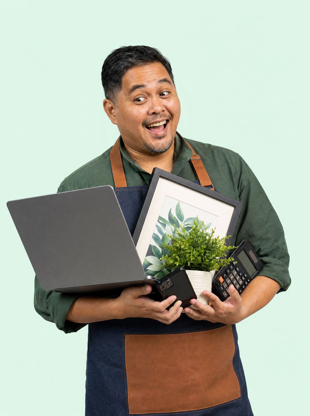 A Singapore small-business owner juggling a laptop, phone, calculator and more